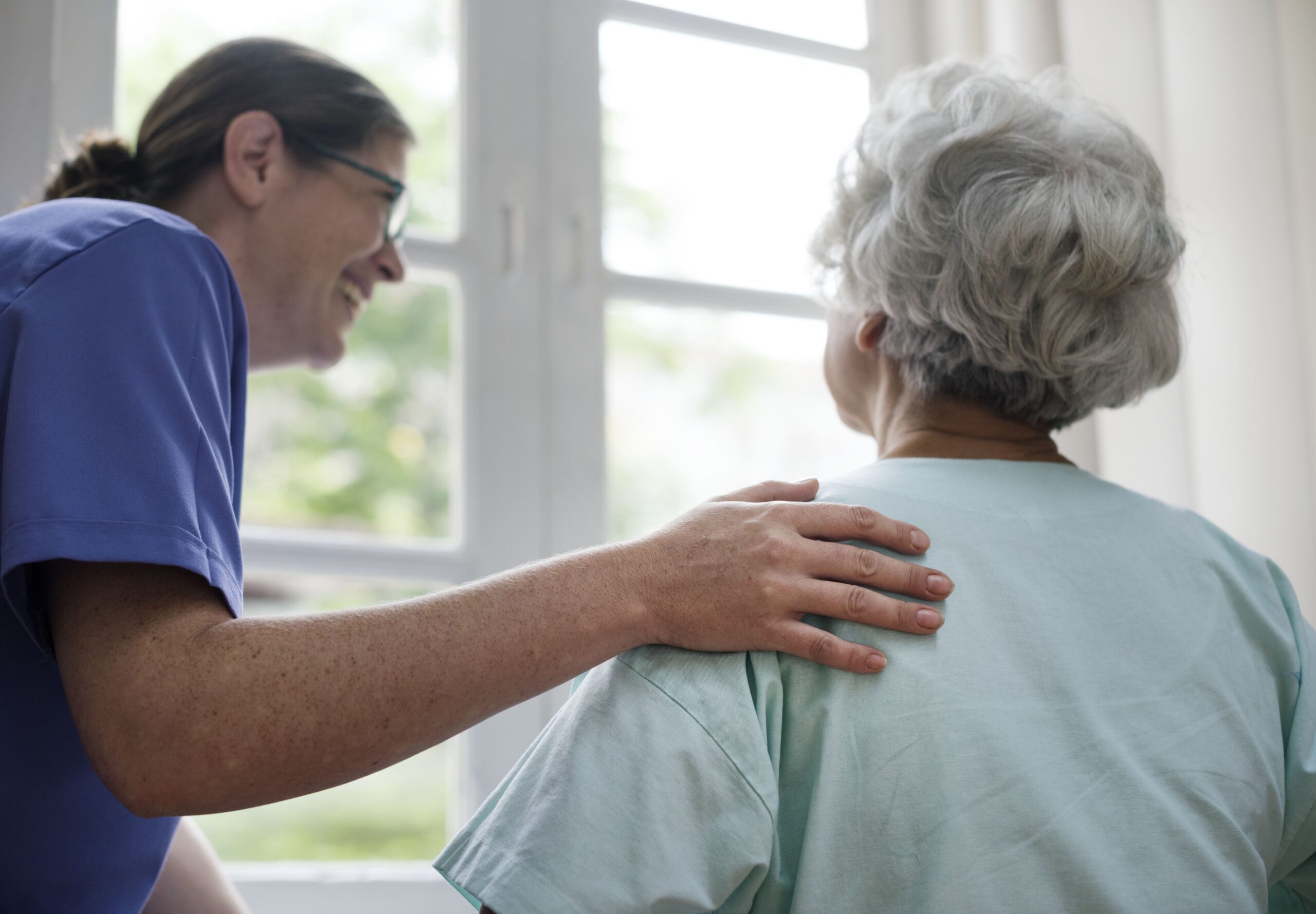 nurse-taking-care-old-woman-min